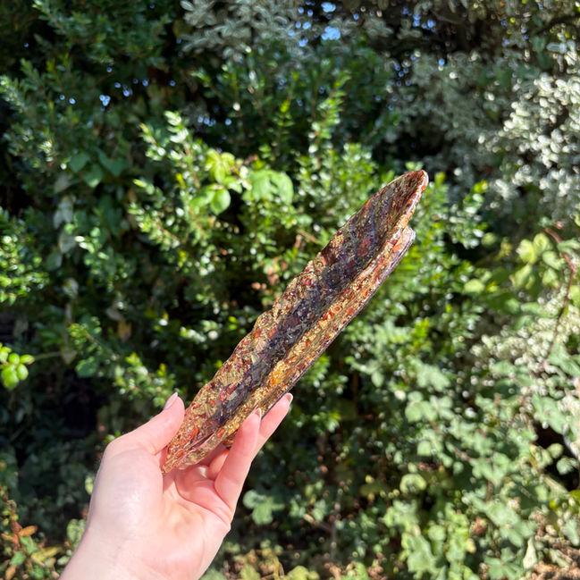 Artistic transparent resin dish with green and red leaf patterns