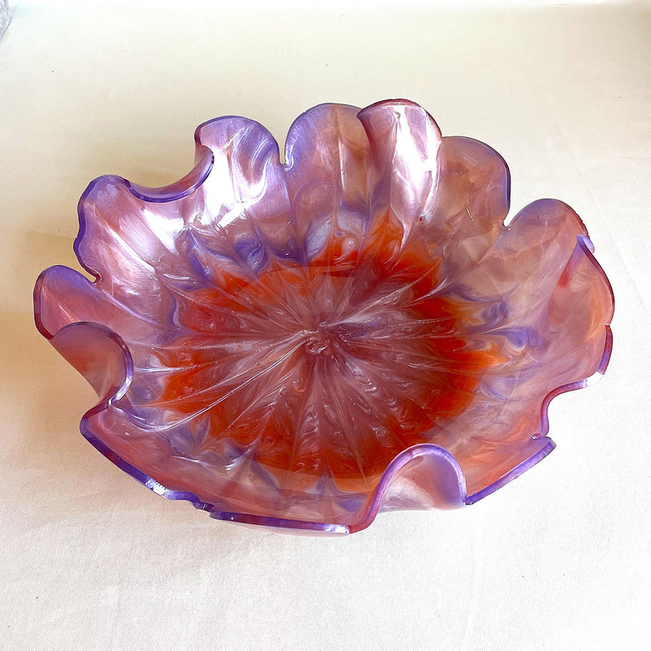 Modern resin bowl with iridescent blush and violet tones and glossy reflective finish