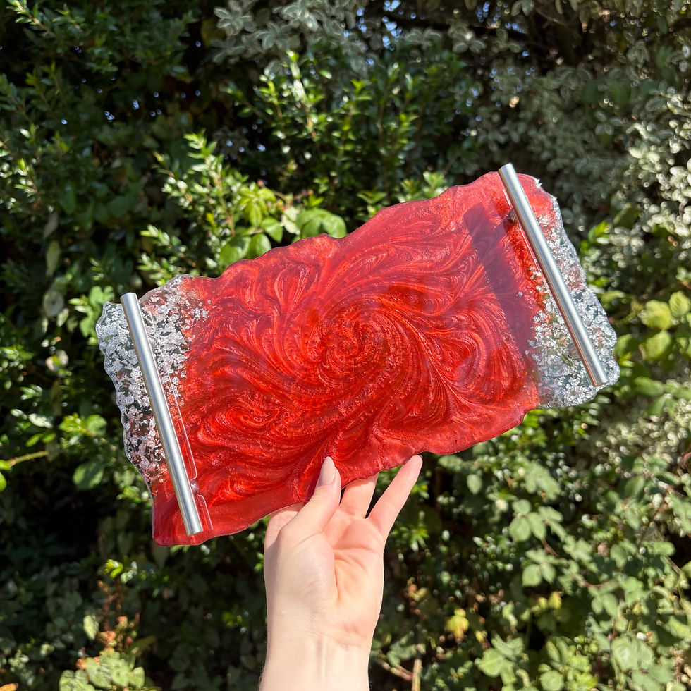 Decorative red shimmer tray with silver hardware and metallic leaf detail