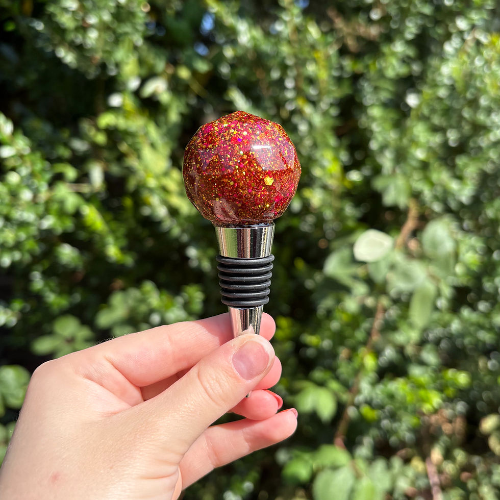 Handmade wine stopper with red glitter resin top