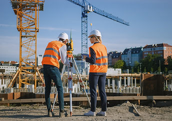 Construction Worker Using Theodolite Surveying Optical Instrument for Measuring Angles in 