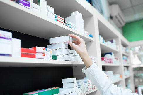 closeup-view-pharmacist-hand-taking-medicine-box-from-shelf-drug-store.jpg