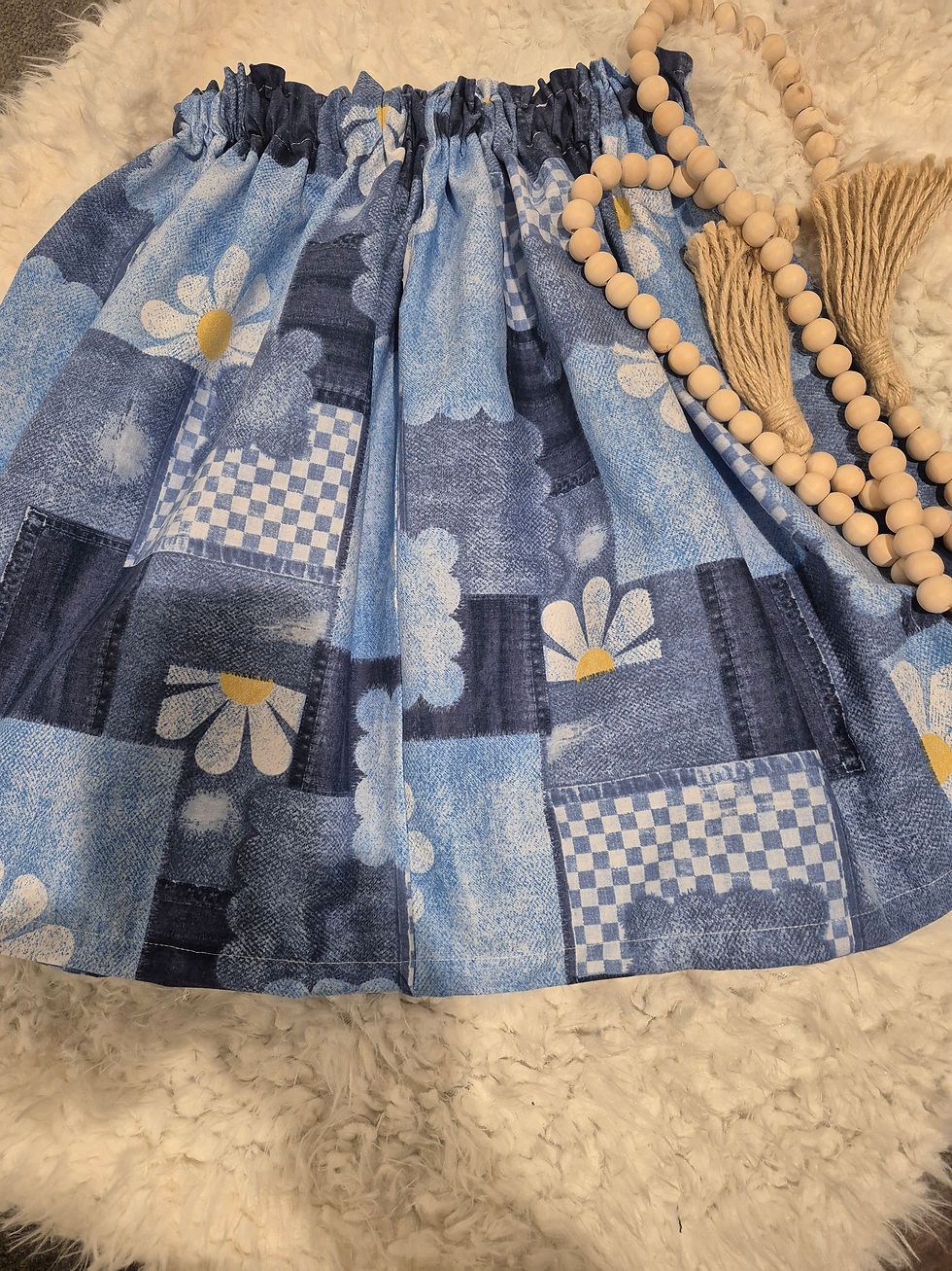 Handmade girls blue patchwork skirt with daisies and checkerboard print