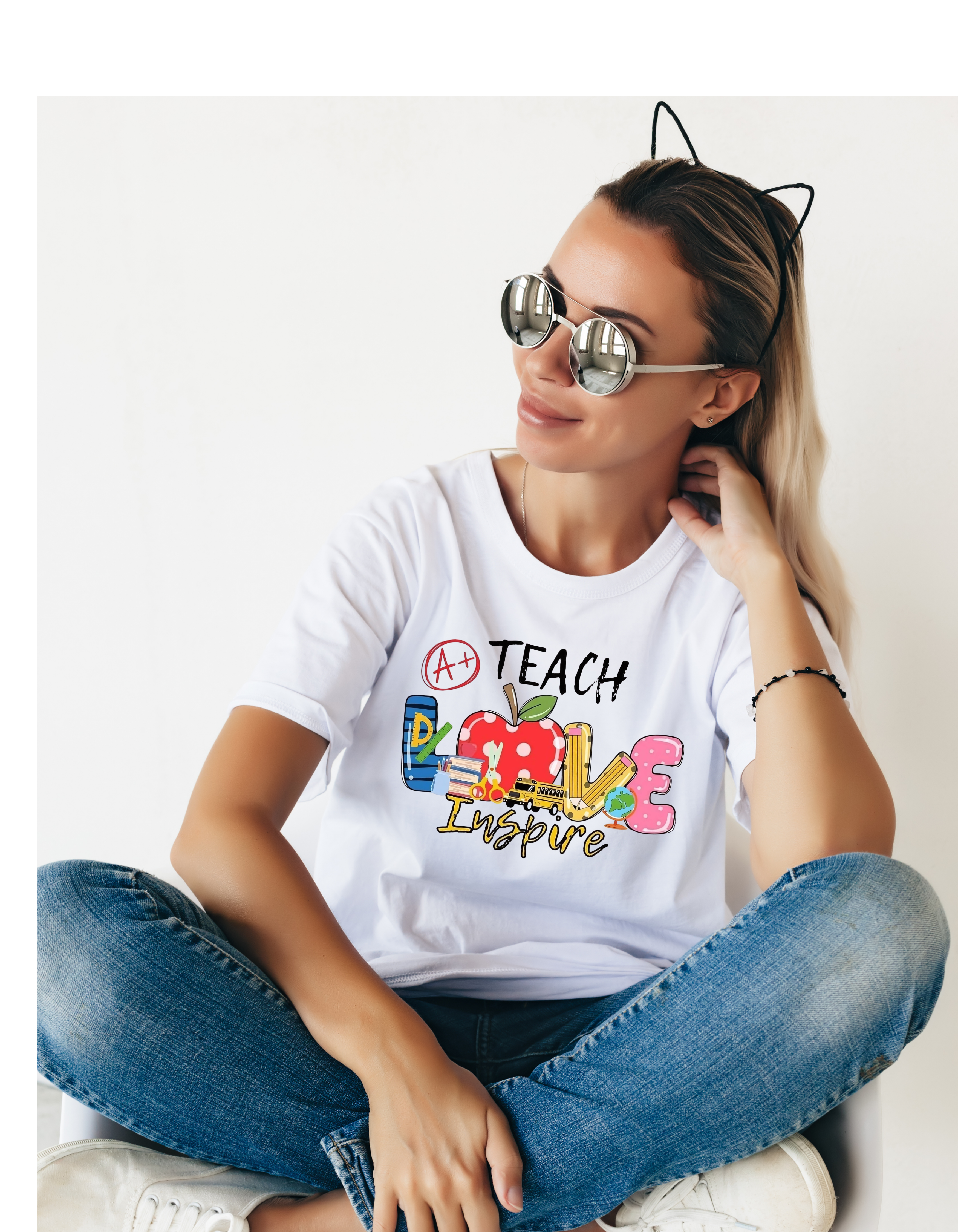 White teacher T-shirt with colorful Teach Love inspire design, school