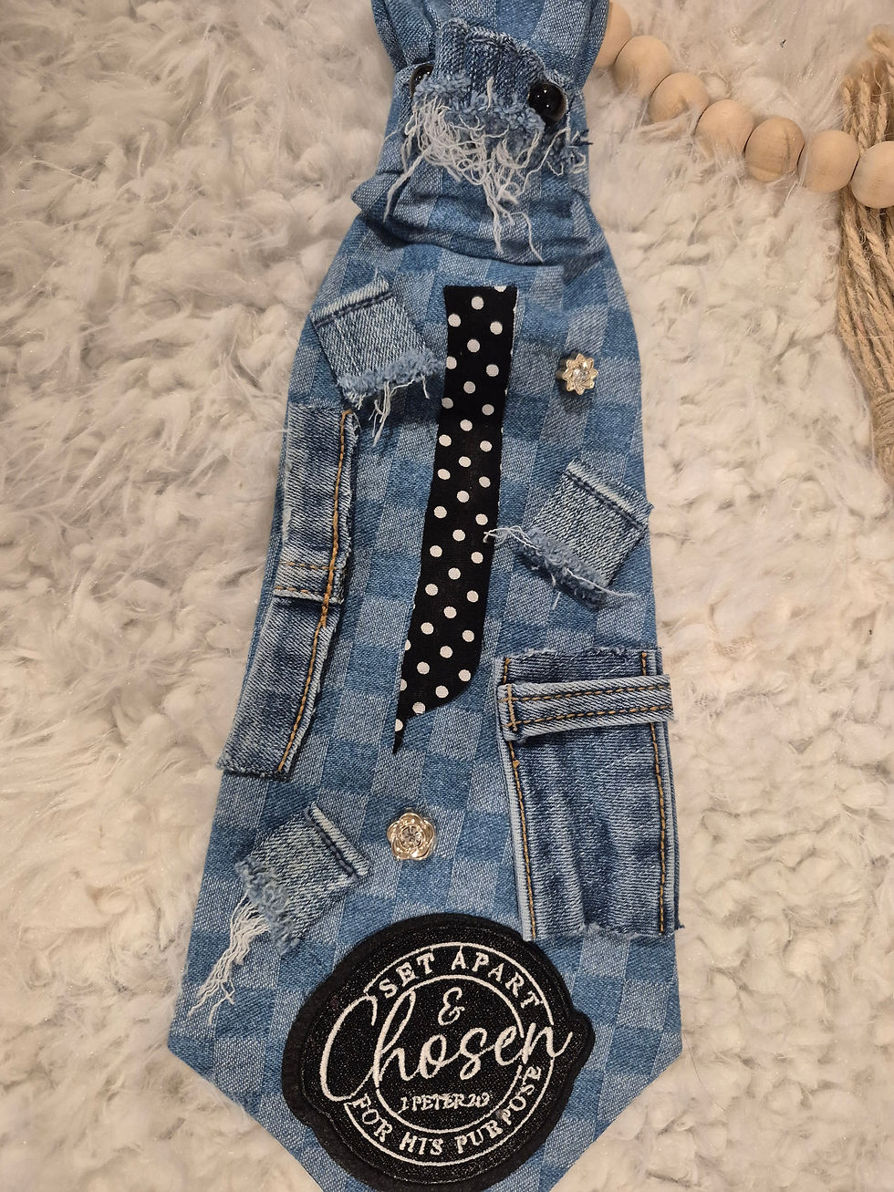 Reworked denim tie featuring distressed patches, polka dot fabric, buttons, and Christian Chosen patch.