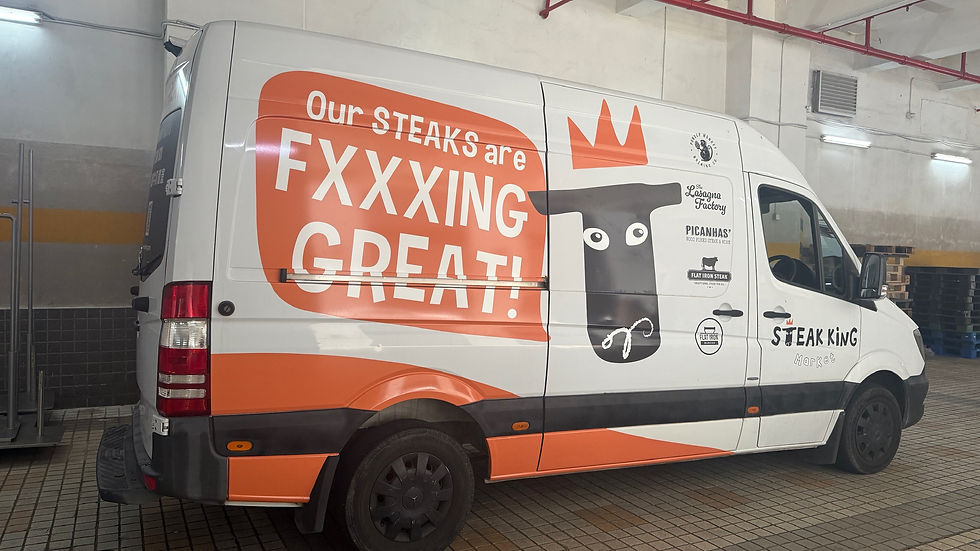 Eye-level view of a delivery van with partial vehicle wrap on the side panel