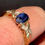Thumbnail: 9ct Gold Sapphire and Diamond Ring Displayed on Ladies Finger