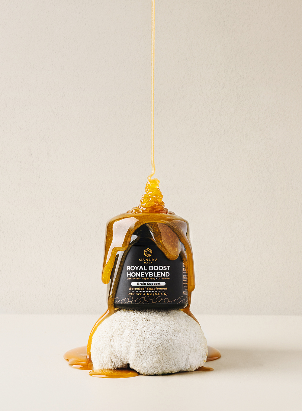 “Jar of honey with honey dripping over the lid on a clean studio background.”
