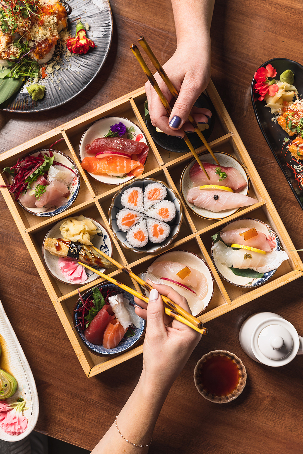 “Assorted small plates on a table, overhead dining scene.”
