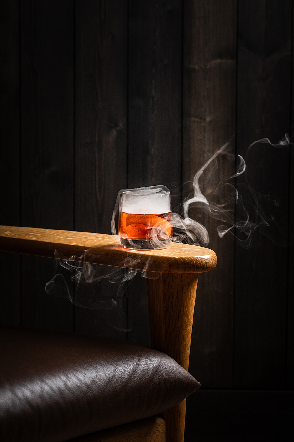 “Cocktail being poured at the bar, close-up.”