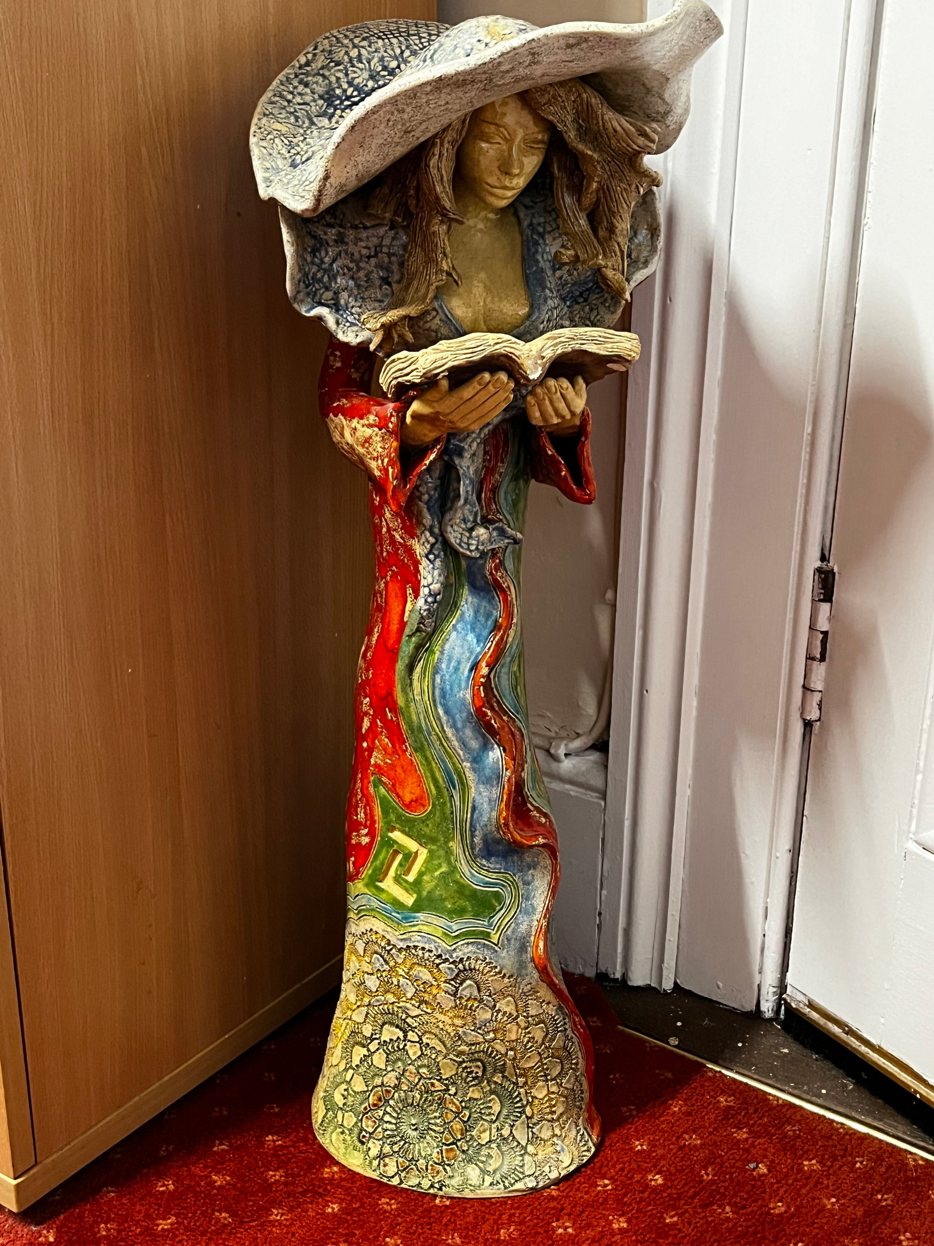 Beautiful porcelain" Lady Reading". about 2 ft in height. Well worth a view!