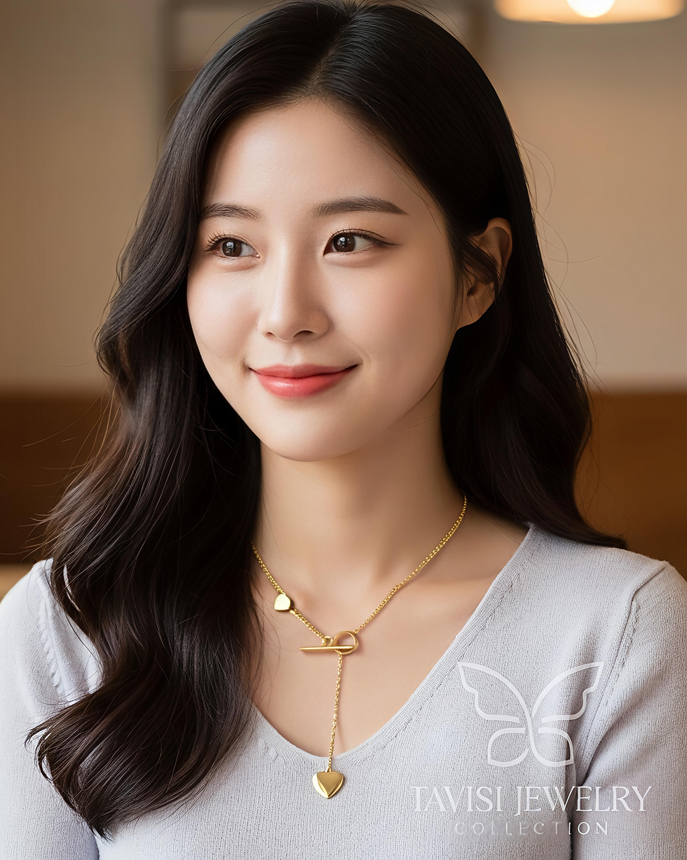 Heart toggle drop necklace with gold tone chain