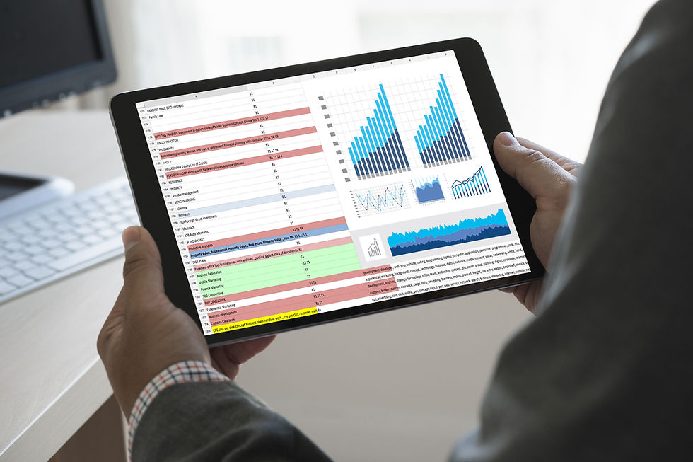 Someone holding a tablet showing analytics and data