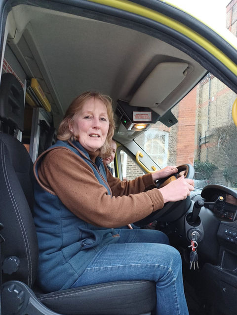 Harriet Sandys at the wheel of an ambulance