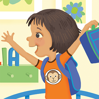 An excited child in a monkey t-shirt holds up her lunchbox.