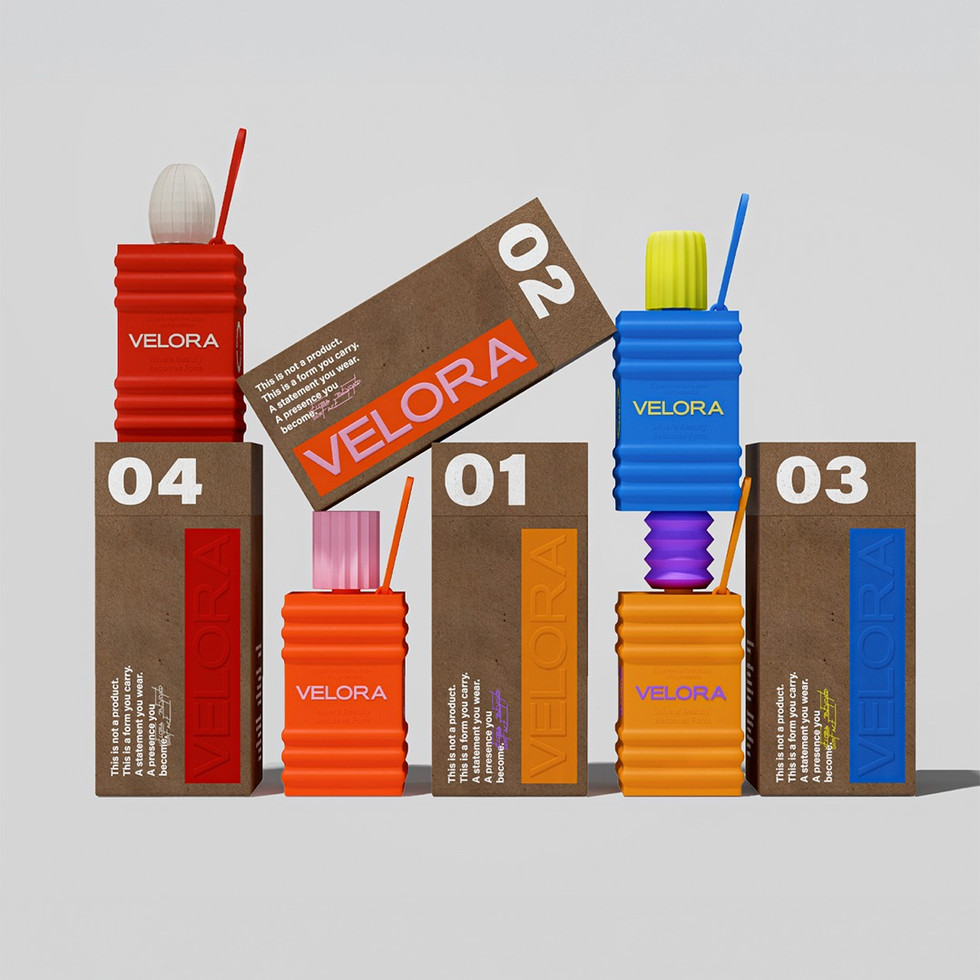 A full Velora packaging lineup featuring four sculptural vessels in red, coral, blue, and golden orange arranged with textured brown boxes in a clean studio composition.