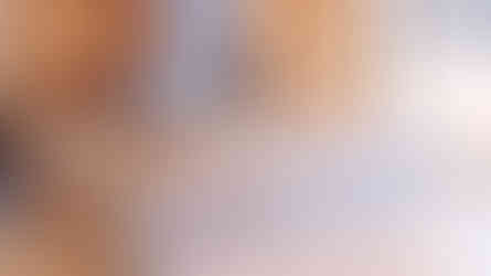 Pluto Coffee + Art Café interior counter with blue-striped tile, pastries on display, and soft-modern café equipment designed by MENR Studios.