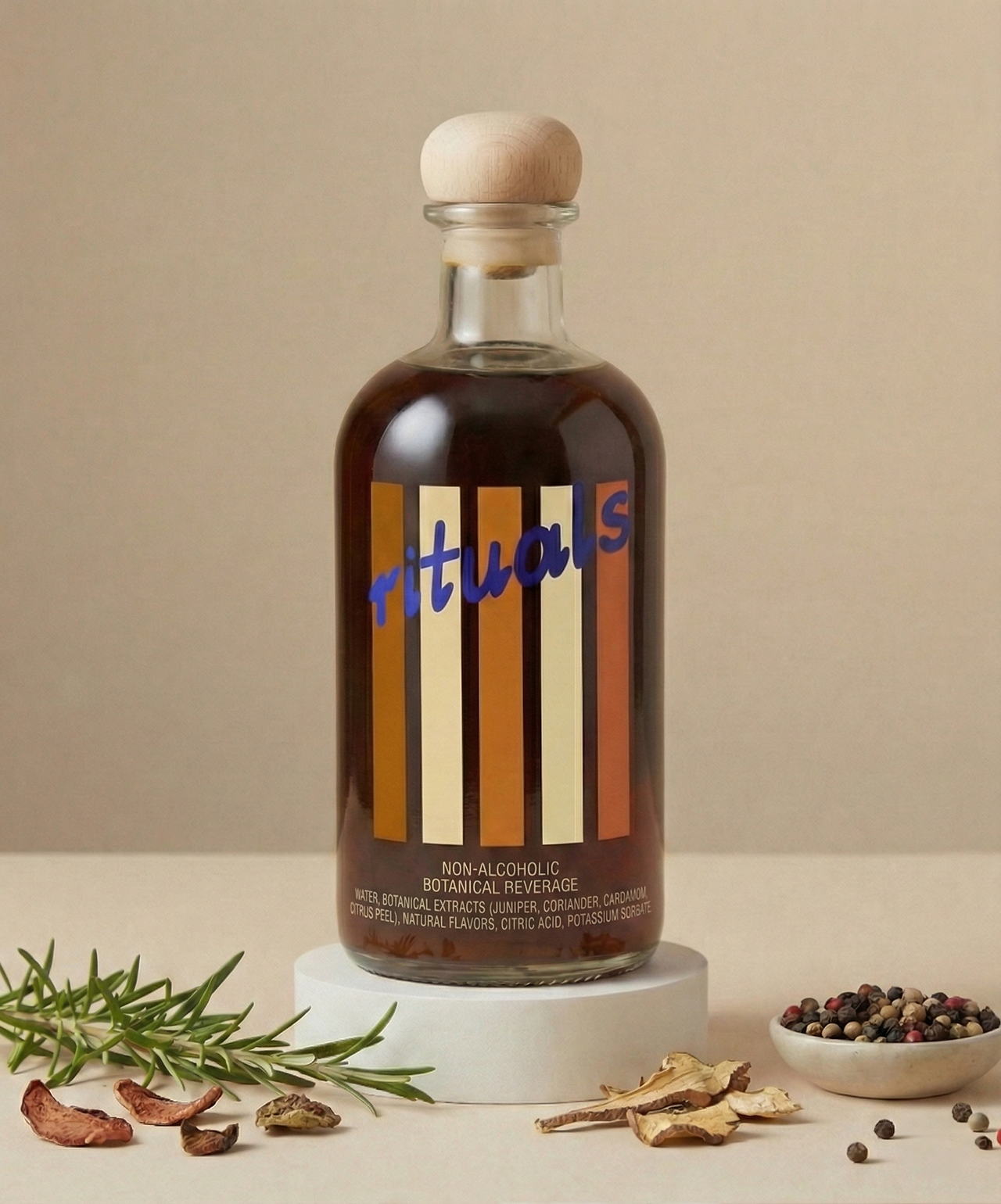 Single glass bottle of a conceptual non-alcoholic botanical beverage with vertical stripe label, wood stopper, and botanical ingredients arranged around the base.