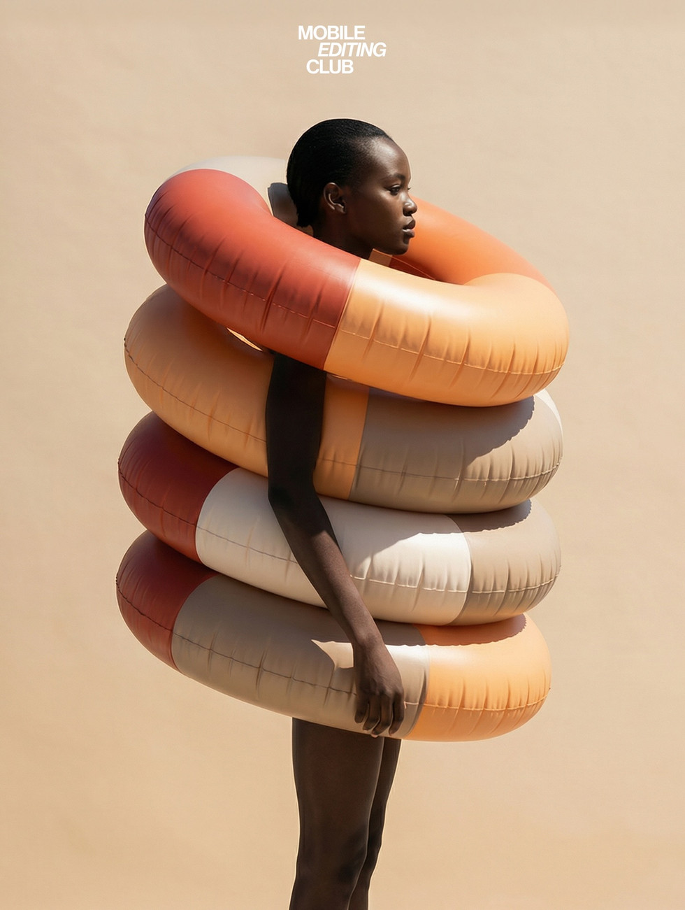 Lifestyle photo showing a model surrounded by terracotta and amber inflatable rings illustrating pale terracotta branding color palette inspiration.