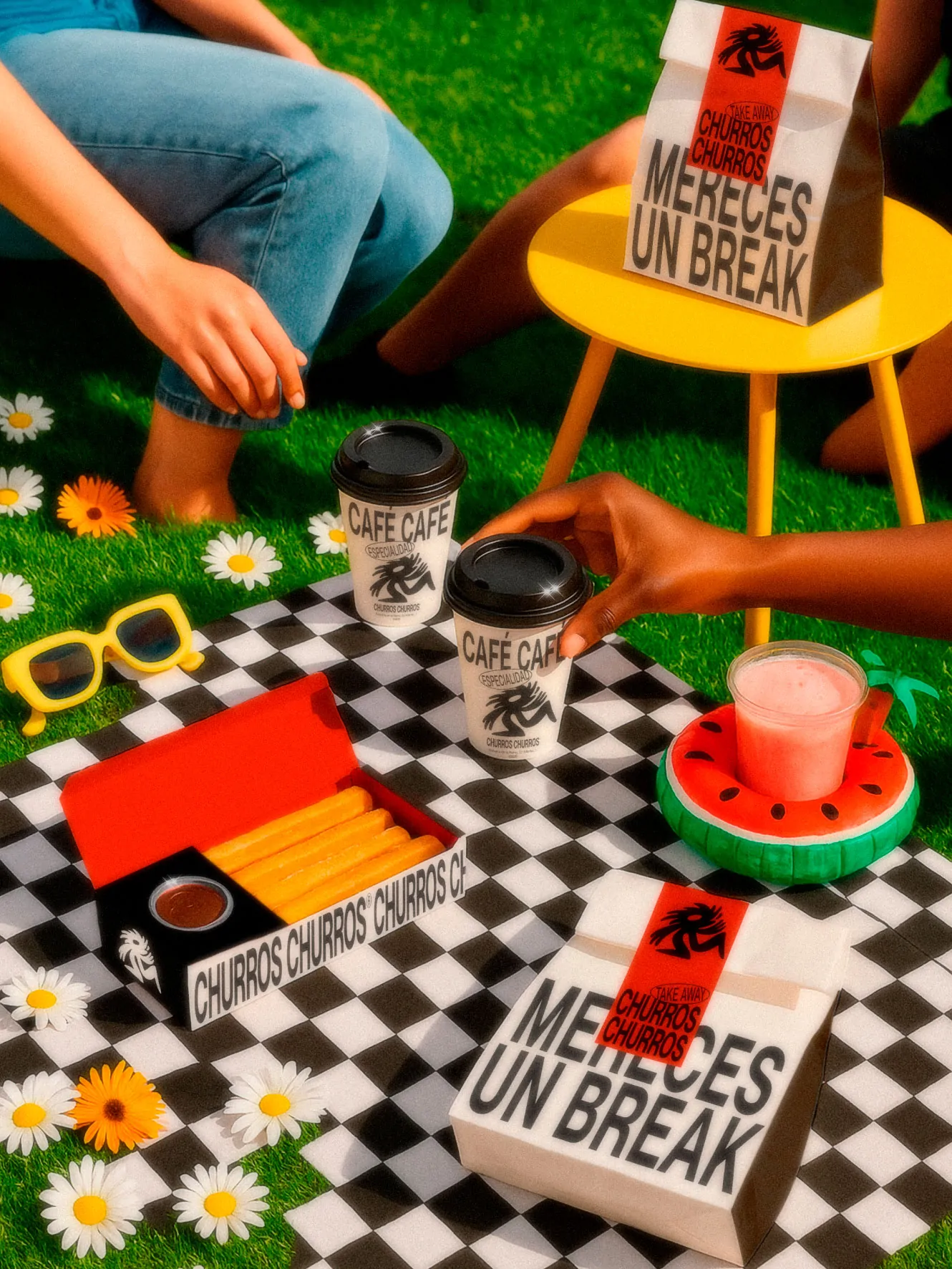 Churros Churros brand lifestyle scene featuring takeaway churros boxes, branded coffee cups, and packaging arranged on a checkered picnic blanket with bright outdoor styling.