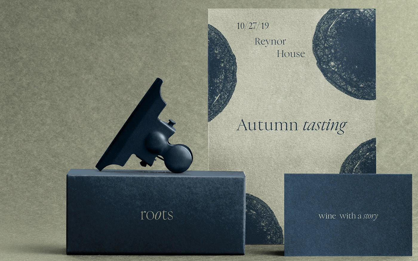 A premium stationery mockup featuring a navy blue wine box and a textured cream 'Autumn Tasting' invitation with organic grape cross-section patterns, accompanied by a slate blue business card against a matching off-white textured background.
