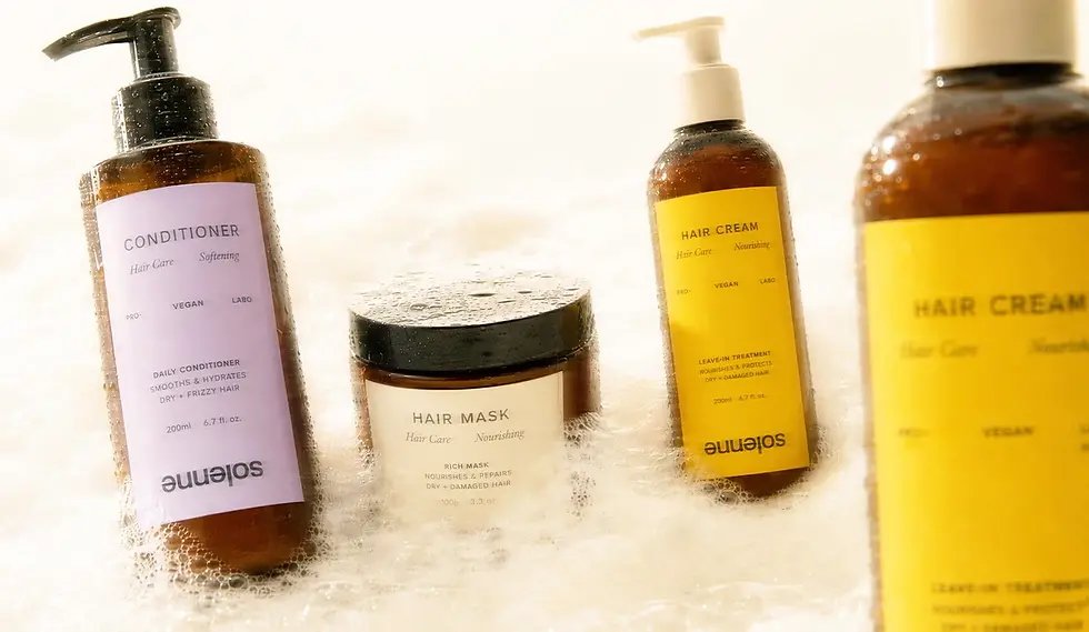 Solenne haircare packaging collection photographed in soft foam, featuring conditioner, hair mask, and hair cream products with lavender, cream, and yellow labels.