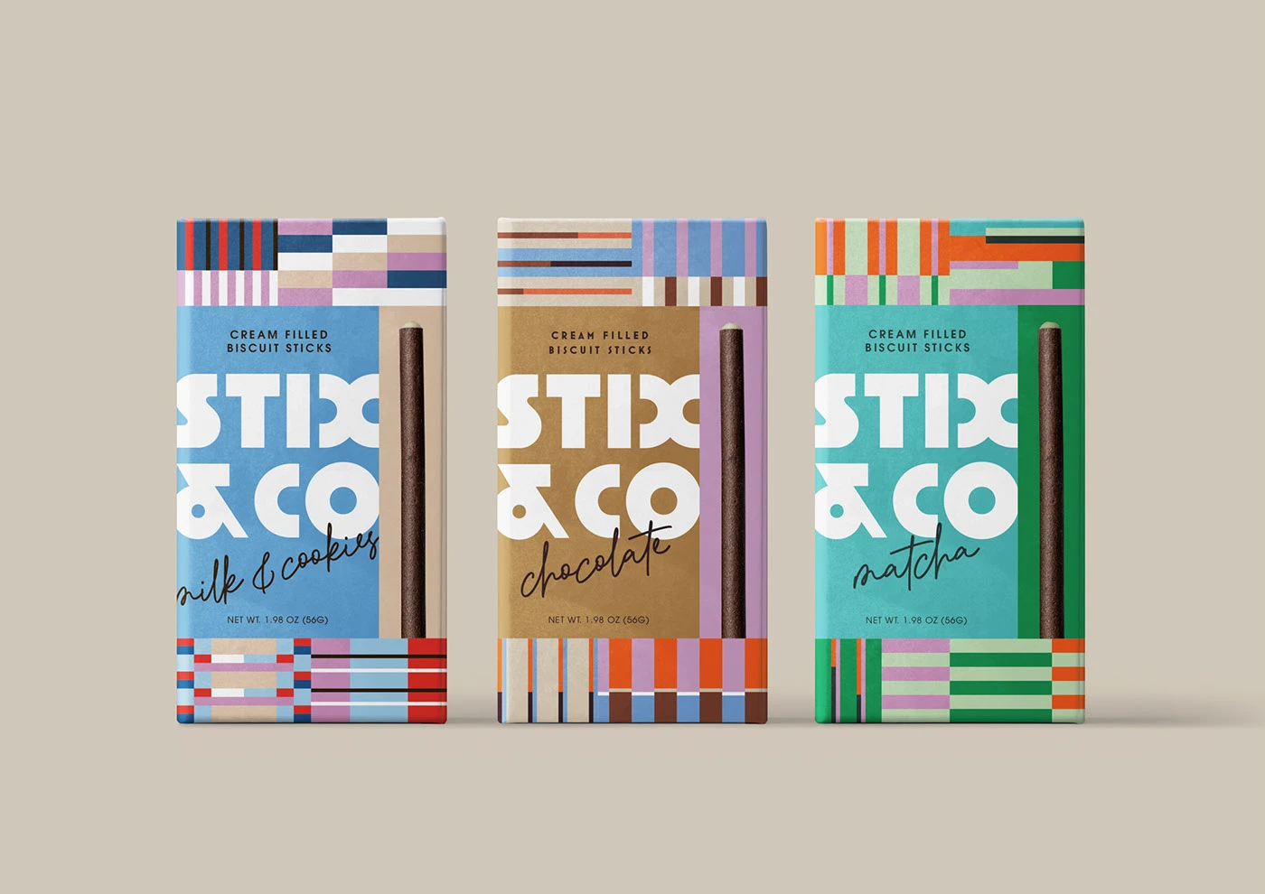 A straight-on mockup of three individual STIX & CO biscuit stick boxes from the Maria Keeler redesign. From left to right: the blue "milk & cookies" flavor, the brown "chocolate" flavor, and the green "matcha" flavor. Each box features the bold white "STIX & CO" logo, distinct modular line patterns, and a single, vertically aligned biscuit stick.