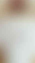 Person wearing an Ember Slown graphic t-shirt featuring the illustrated cacao mascot and playful chocolate brand identity design.