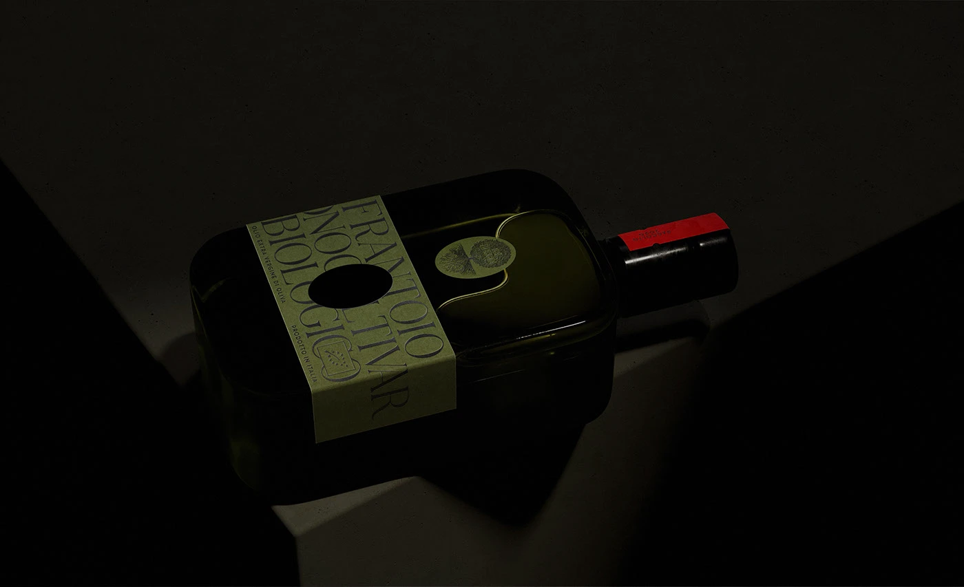 Dark, moody studio photograph of La Leccia organic olive oil bottle featuring minimalist green label typography and sculptural glass packaging design.