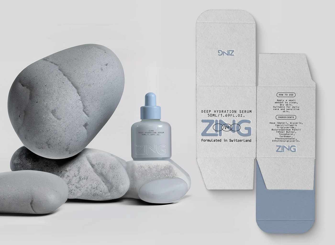 ZING deep hydration serum bottle displayed beside its open carton dieline, with soft blue branding, textured white packaging, ingredient details, and smooth gray stones.