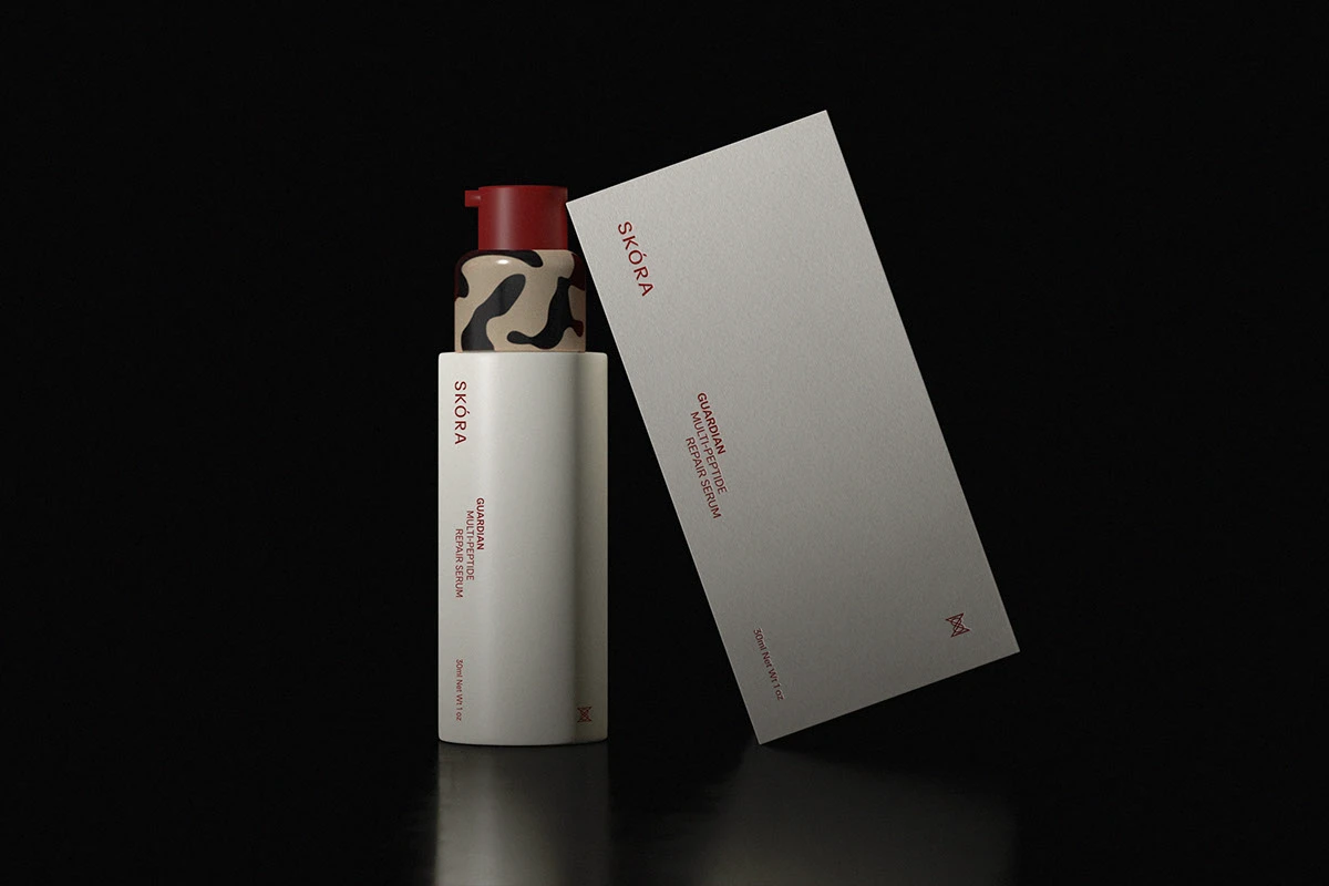 Skora Guardian Multipeptide Repair Serum packaging shown with bottle and carton against a dark background, highlighting clean label design, vertical typography, and premium skincare packaging details.