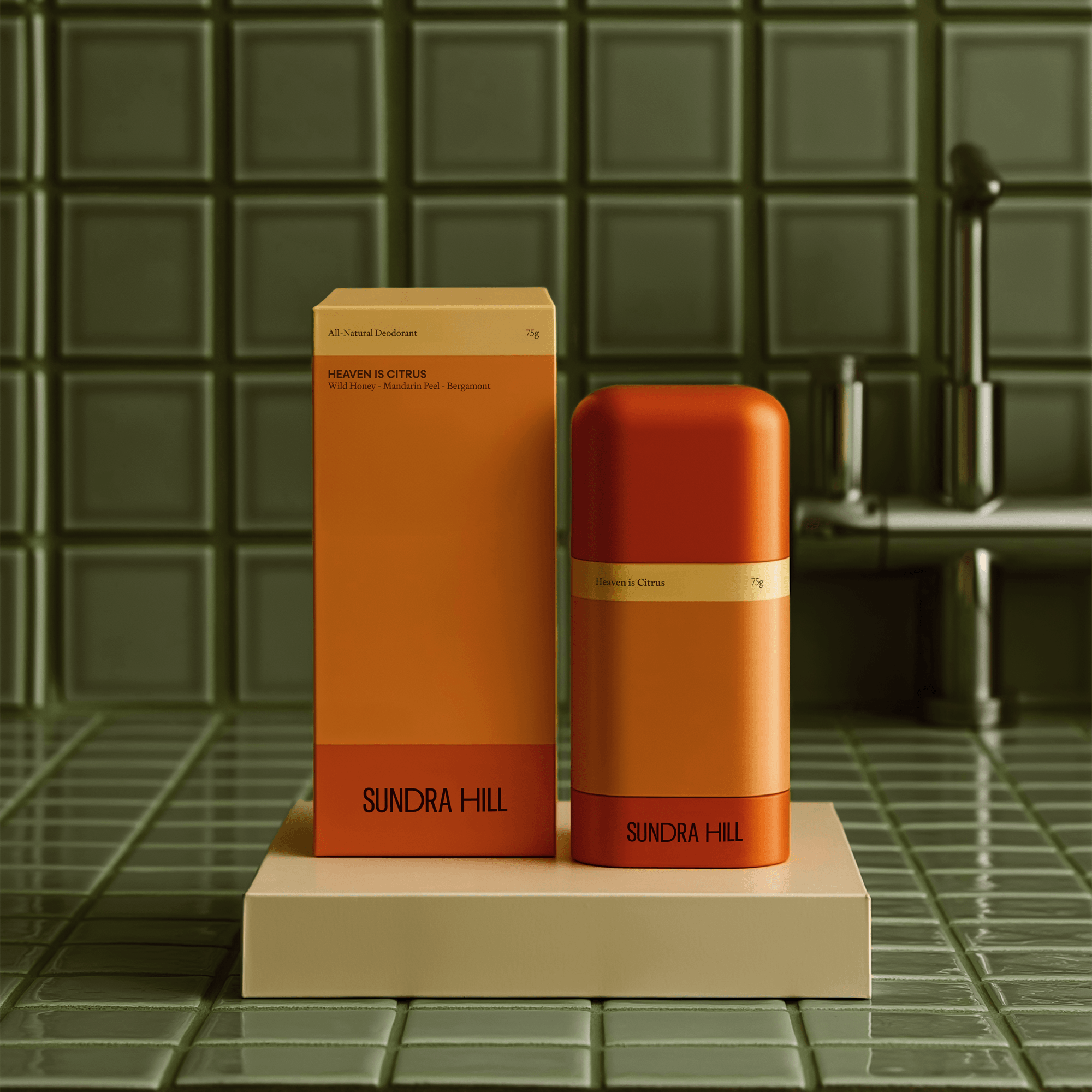 Sundra Hill deodorant packaging design in warm orange tones by Studio One Eighty, featuring modern minimal typography and geometric structure on a tiled bathroom surface.