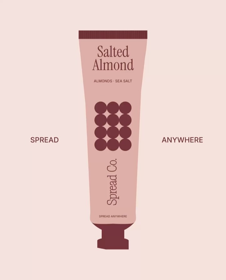 Salted Almond nut butter tube packaging for Spread Co., featuring minimalist typography, soft pink tones, and circular graphic elements.