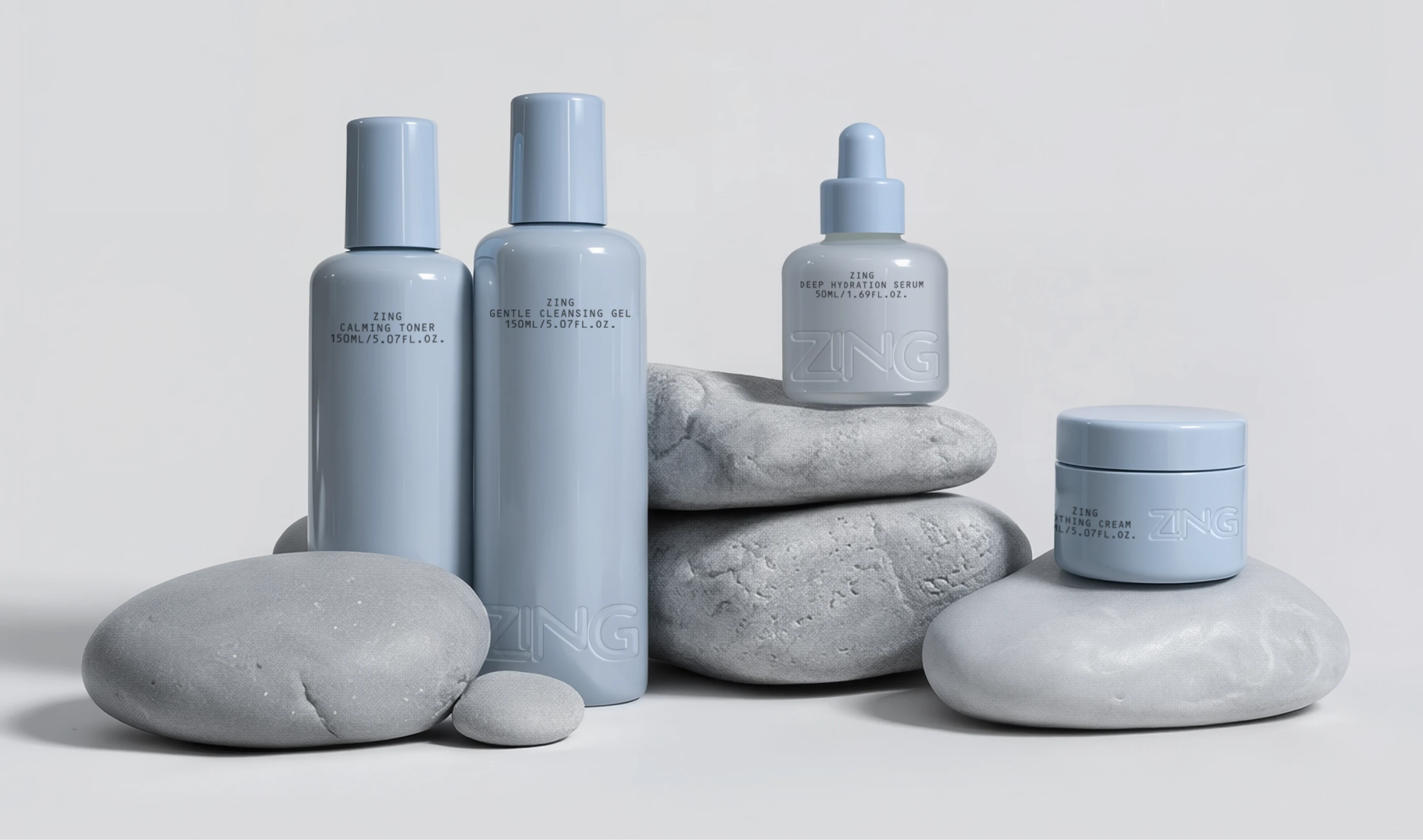 Soft blue ZING skincare bottles and cream jar arranged with smooth gray stones, showing a calm modern packaging system with rounded forms and subtle embossed branding.