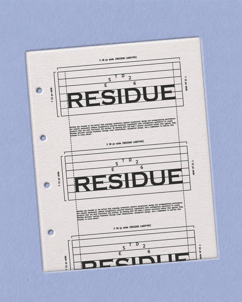 Printed logo construction sheets arranged on a pale blue surface, showing the Residue wordmark, alignment grids, spacing measurements, and brand text.