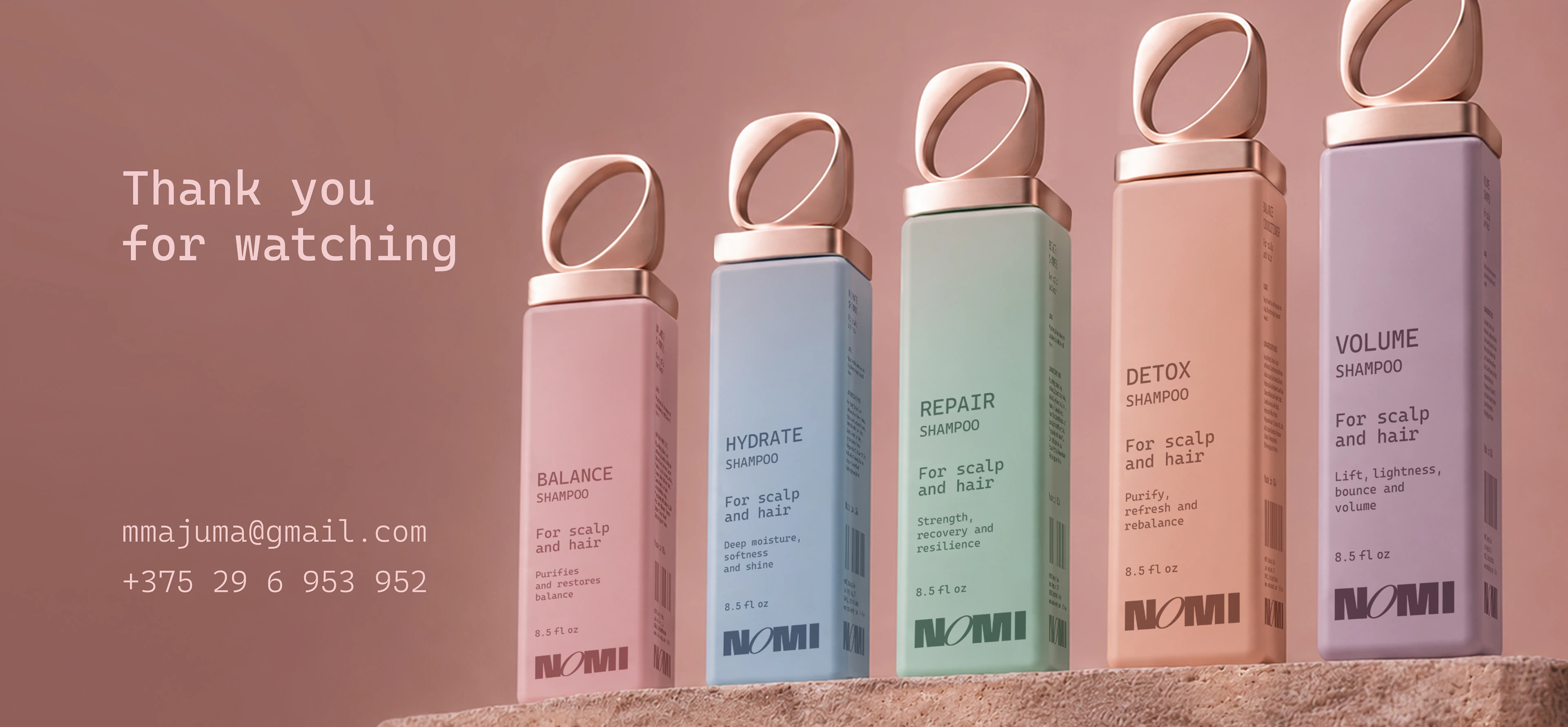 Five pastel NOMI shampoo bottles displayed in a closing presentation panel with sculptural rose-gold loop caps.