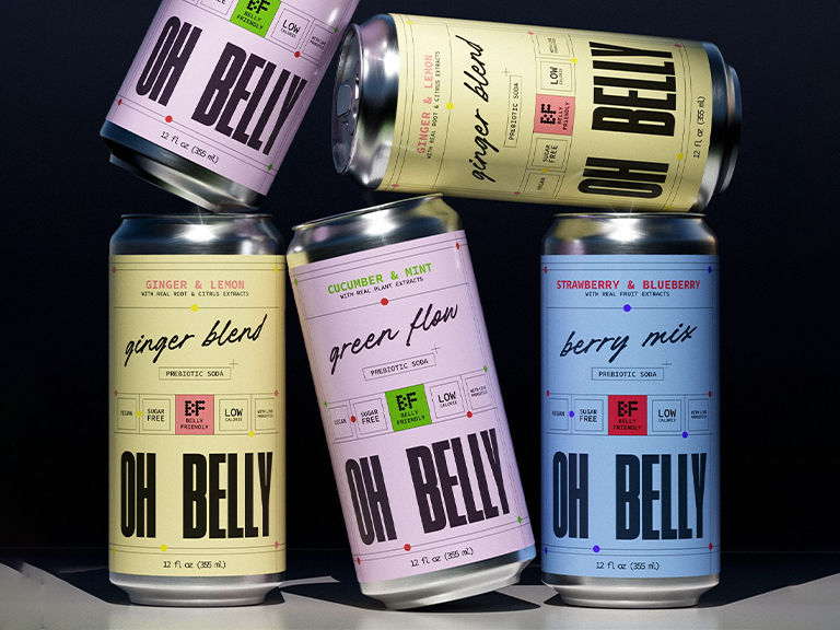 Stacked Oh Belly prebiotic soda cans showcasing a bold packaging system with pastel color palettes, expressive typography, and a cohesive functional beverage brand identity.