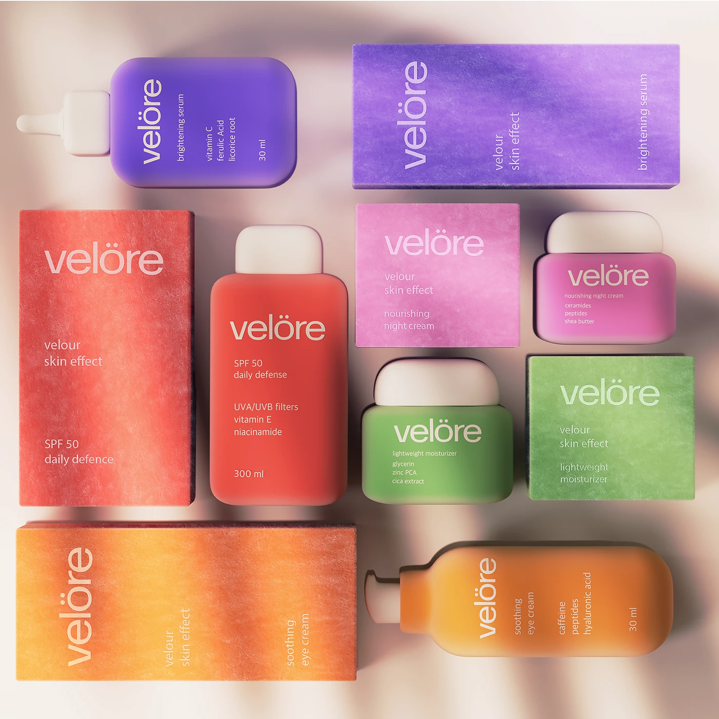 Flat lay of the Velöre skincare packaging system with colorful bottles, jars, and textured boxes arranged to show the full product range and color-coded design.