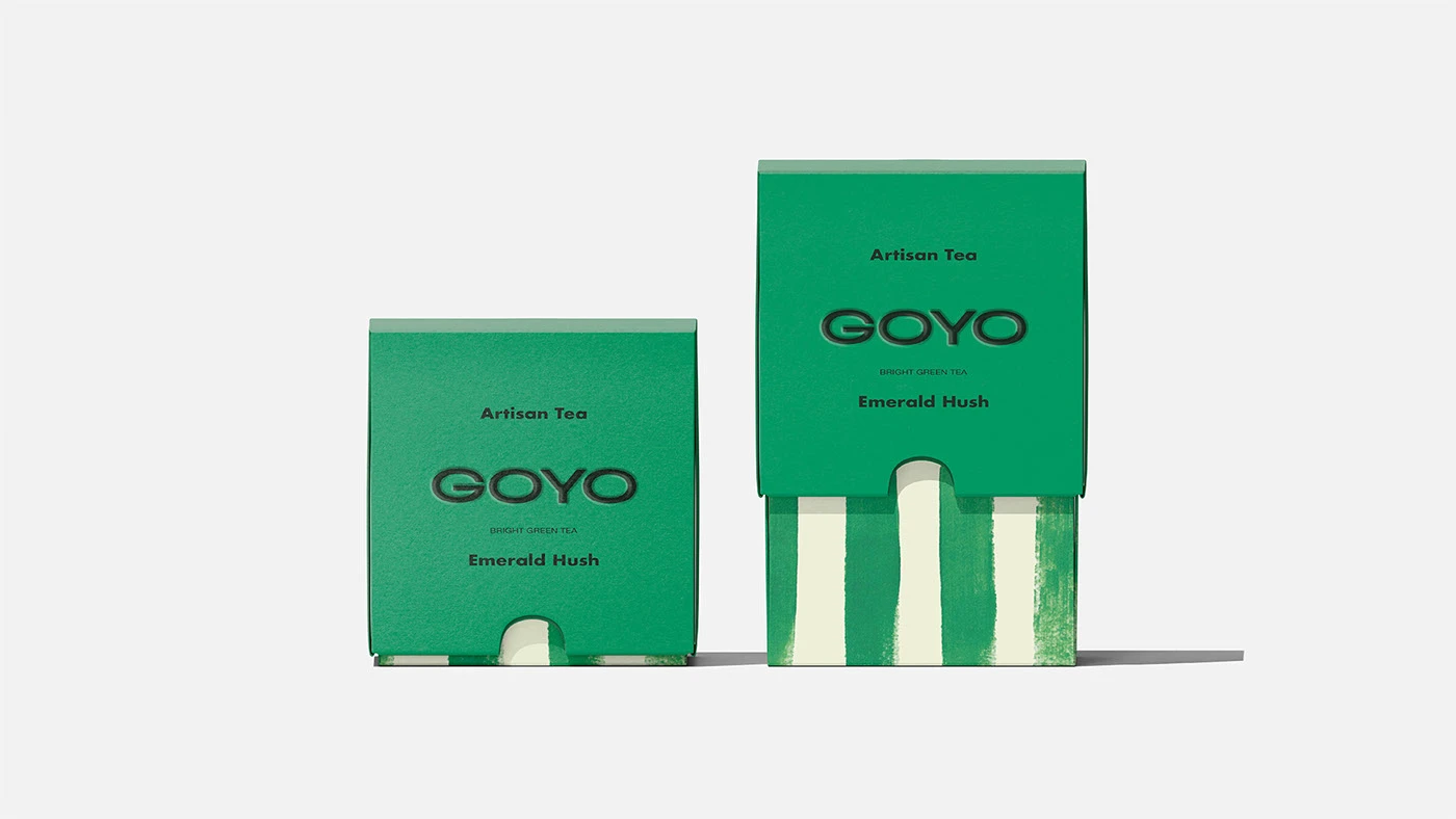 Goyo Tea packaging design in bold green for Emerald Hush bright green tea, highlighting minimalist branding with vertical painted stripe accents