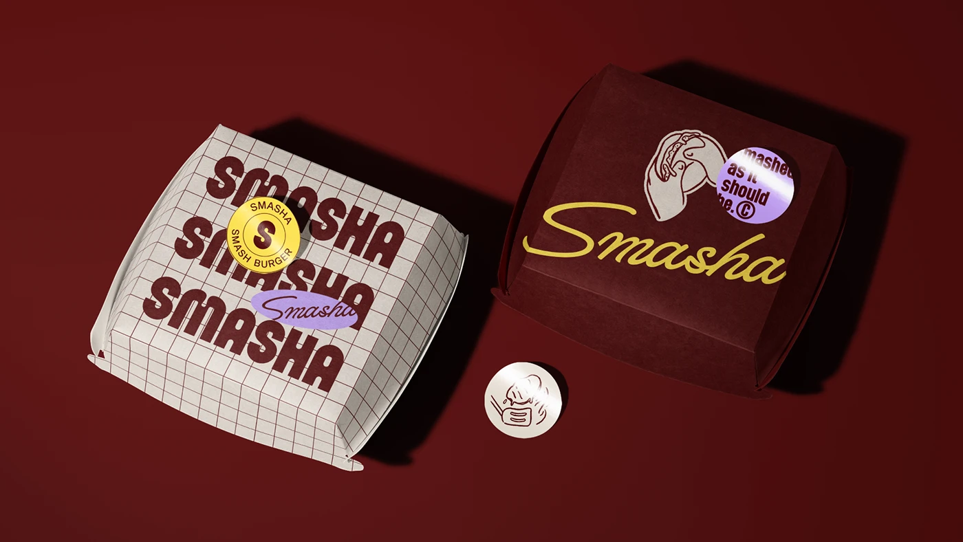 Smasha burger packaging displayed on deep burgundy background, featuring grid patterns, script logo, illustrated icon badge, and branded stickers.