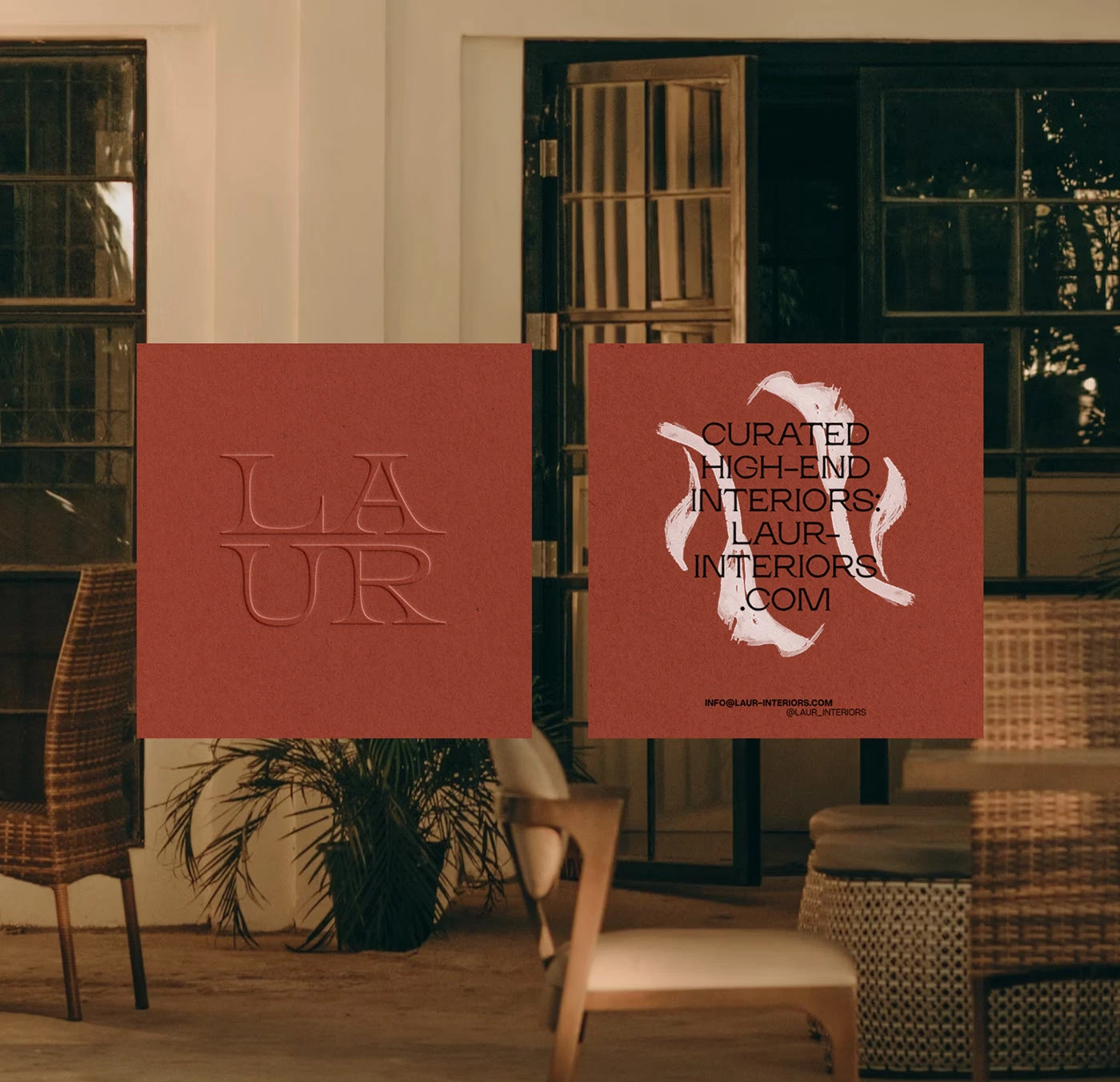 Terracotta brand cards and signage for Laur Interior Design Studio, designed by Yana Vision with embossed logo, modern serif typography, and tactile branding style inspired by contemporary minimalism.