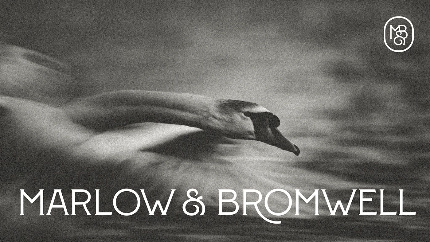 Marlow & Bromwell Manor logo with motion-blurred swan swimming across water in black and white, paired with large white serif typography