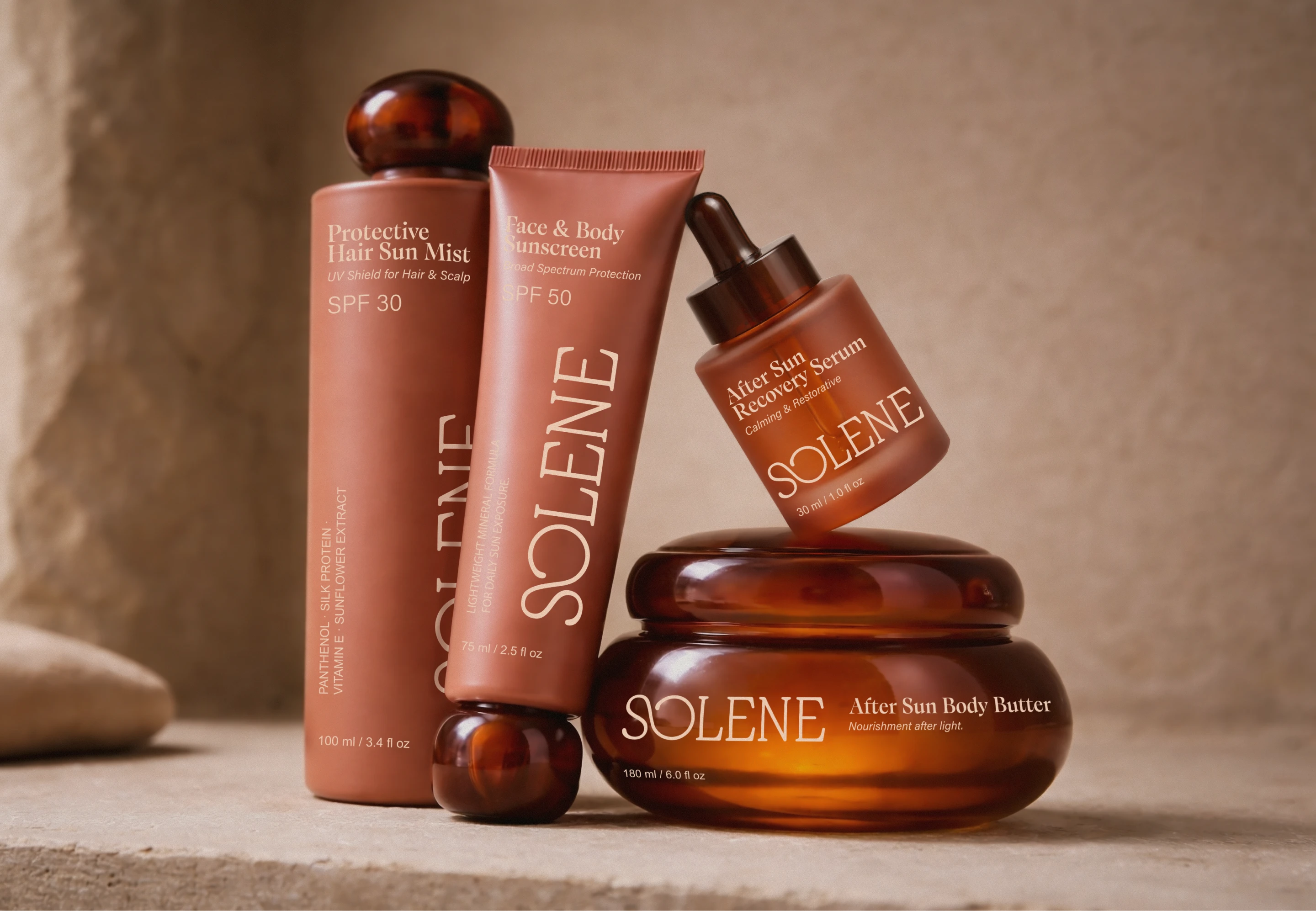 Solene SPF sunscreen product range featuring protective hair sun mist, face and body sunscreen, after sun recovery serum, and amber after sun body butter packaging.