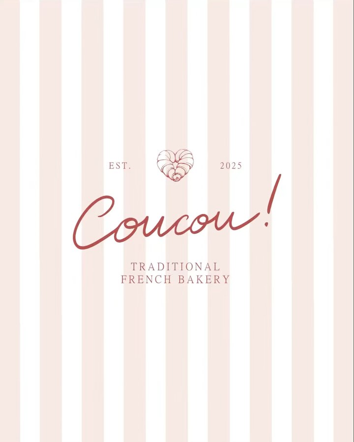Coucou bakery logo displayed on a soft pink striped background, featuring hand-lettered typography and a croissant heart emblem