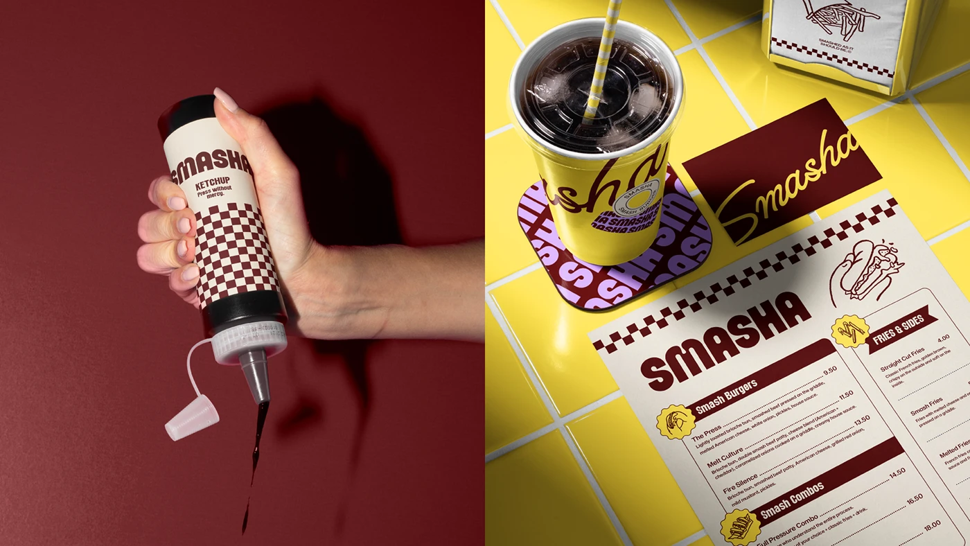 Close-up of Smasha ketchup bottle dispensing sauce alongside branded drink cup, menu, coaster, and printed materials arranged on yellow tiled surface.