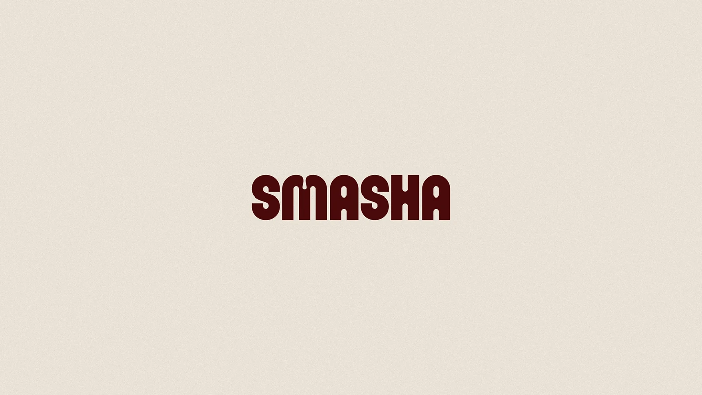 Centered Smasha wordmark displayed on a soft neutral background, emphasizing bold typography and brand color contrast.