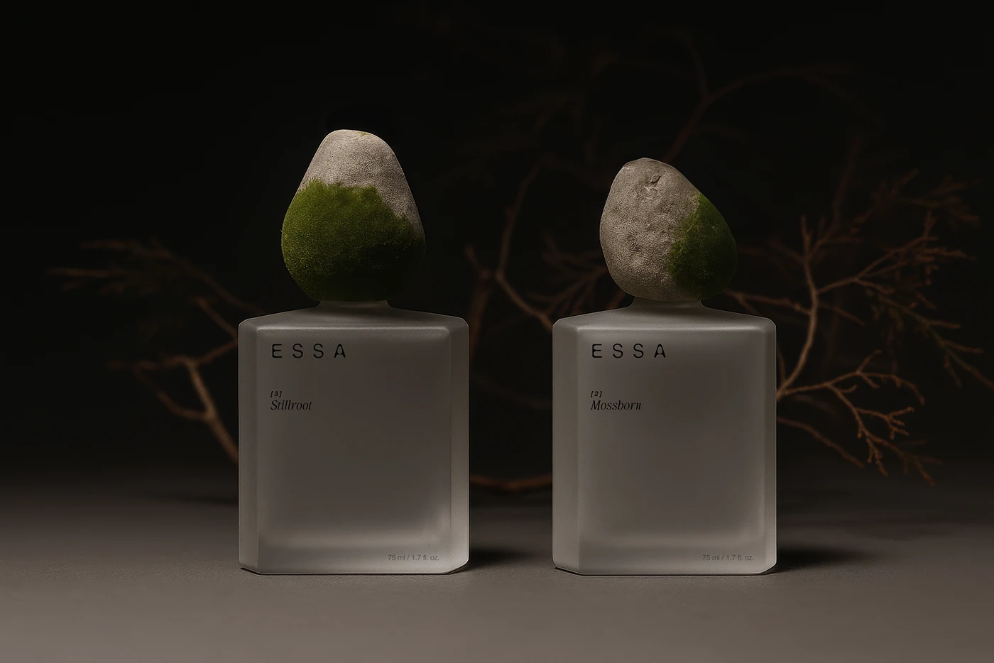 ESSA perfume branding and packaging design by Lym Design Studio featuring two sculptural bottles with stone and moss caps — luxury minimal identity and product photography trend.