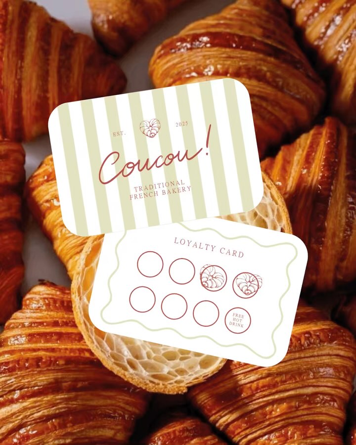 Coucou bakery loyalty card design shown over freshly baked croissants, highlighting striped branding, soft green tones, and hand-drawn details