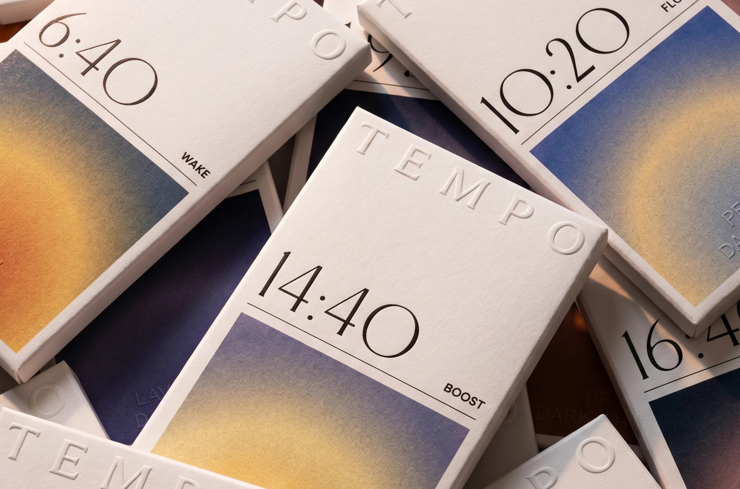 TEMPO chocolate packaging design by LYM Design Studio featuring layered time-based chocolate bar boxes with embossed white branding, clean typography, and gradient artwork for different product moods.