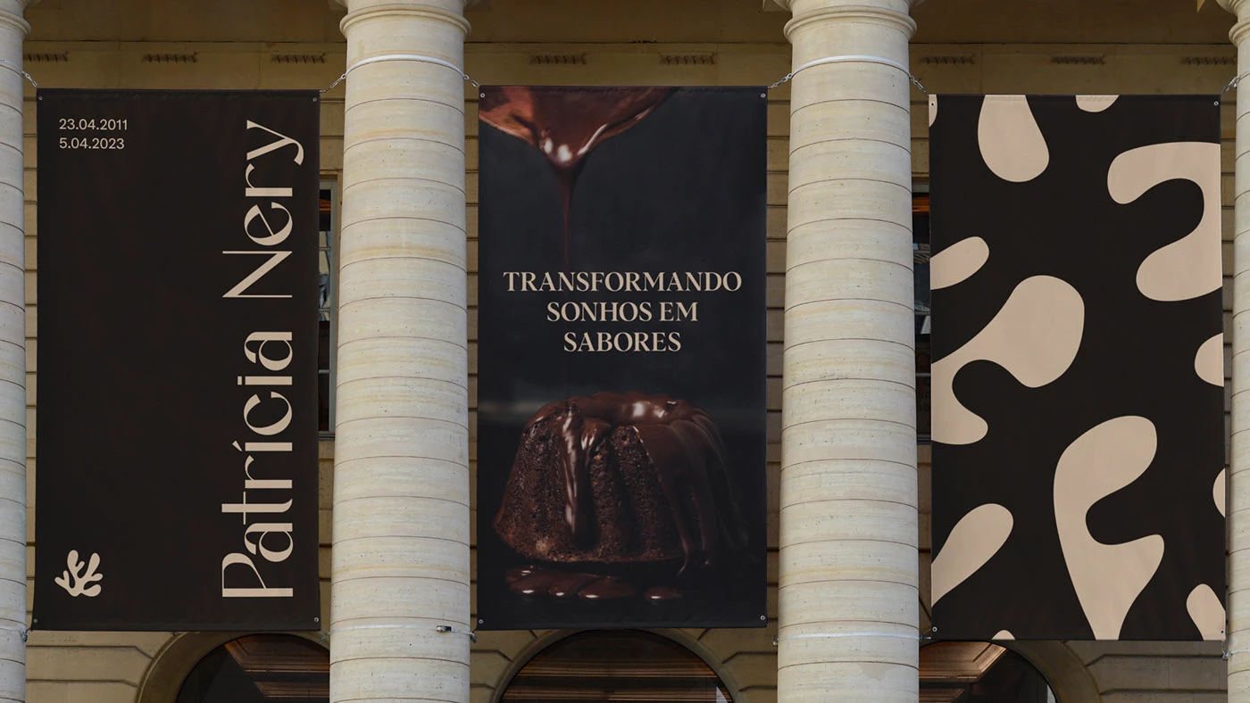 Large vertical outdoor banners showcasing Patricia Nery brand identity with bold typography, chocolate dessert photography, and organic graphic patterns.